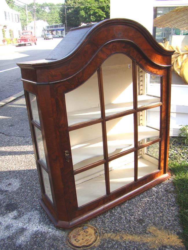 A small and attractive 19th century Dutch hanging wall cupboard in burled walnut